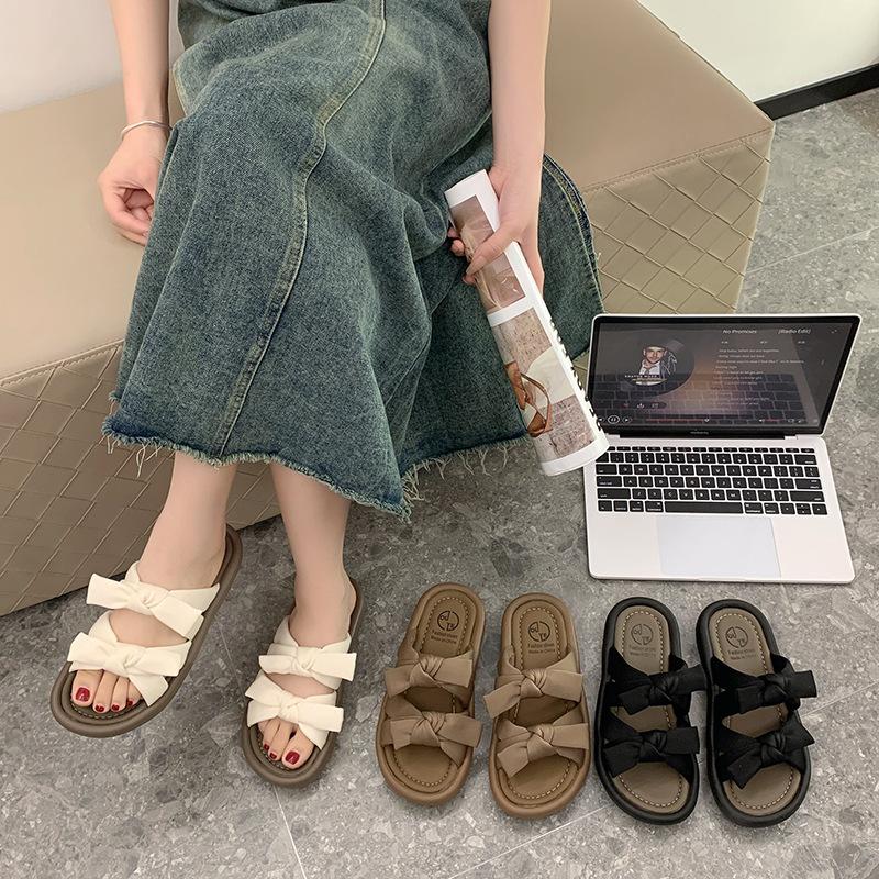 Fairy wind bow stepping on shit feeling wearing cool slippers in the summer of 2025 new versatile flat-bottomed beach one-word drag