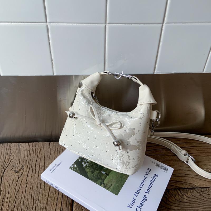 Niche high-value casual shoulder bag, new summer bow fashion portable pleated dumpling bag