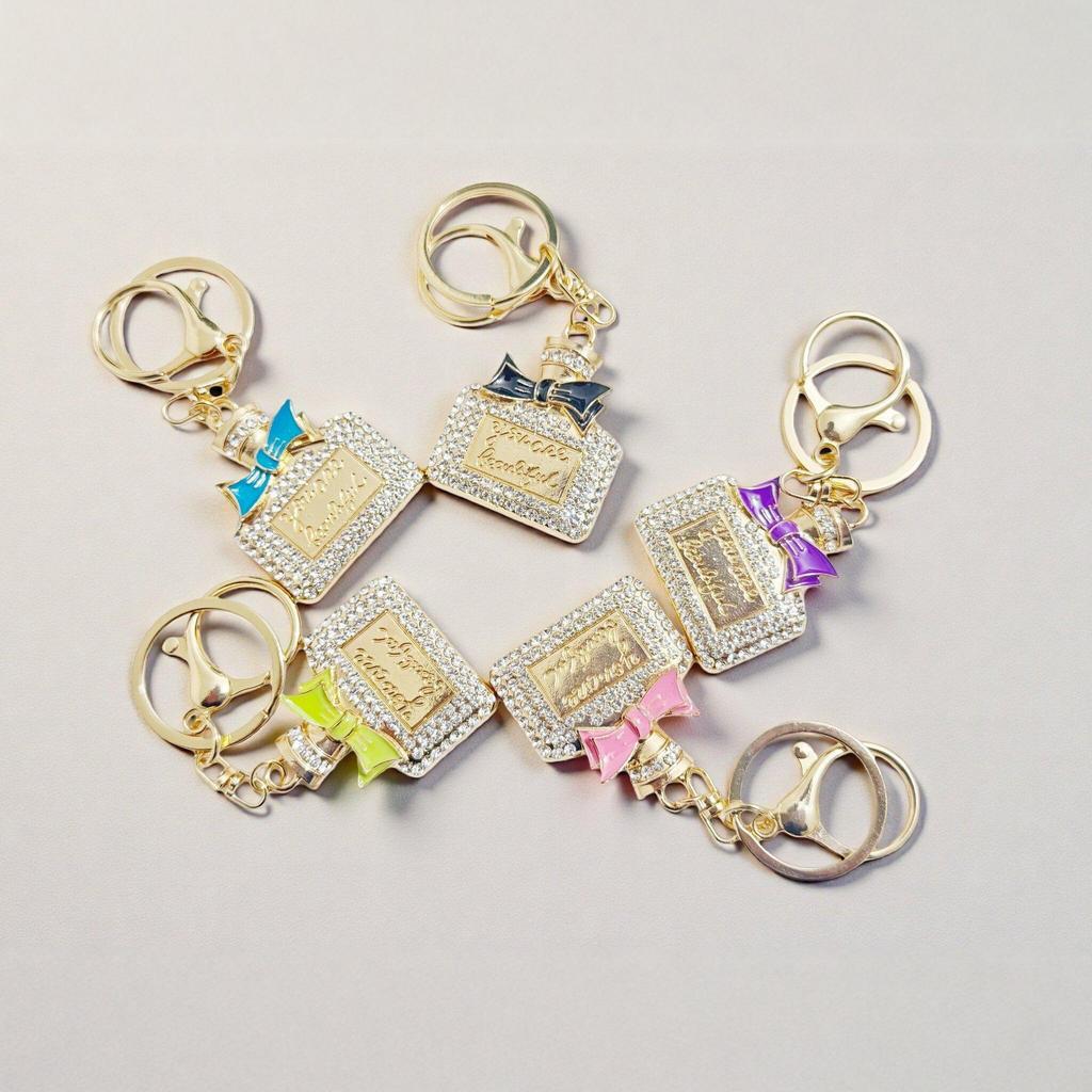 Radiant Bow Perfume Bottle Keychain & Elegant Bag Pendant Gift