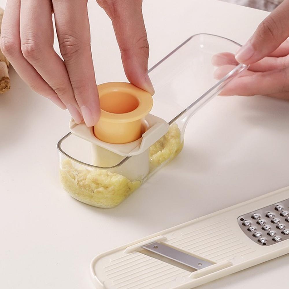 Tre-i-ett hållbar manuell hushållsmaskin i plast för vitlökstrampning, kvarn, rivare, multifunktionellt ingefära- och vitlöksverktyg