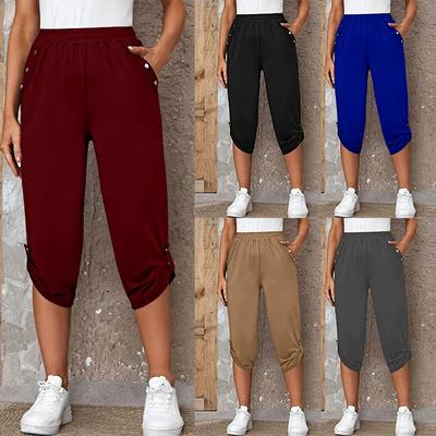 Frauen mit Taschen elastische Taille abgeschnitten Hose Sommer Knopf