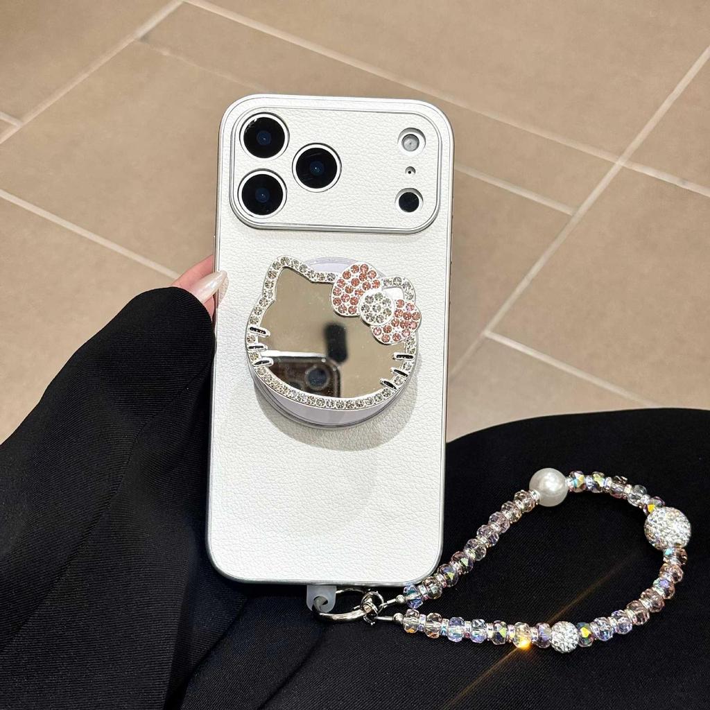 Premium Rhinestone KT Cat Mirror Phone Case for iPhone 17 Pro Max with Lychee Pattern and Magnetic Stand