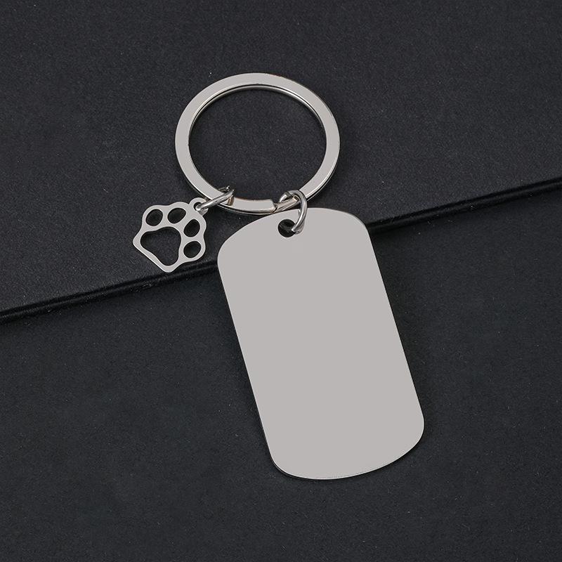 Breloczek do kluczy z łapą psa drukowaną laserowo - Międzynarodowy metalowy prezent