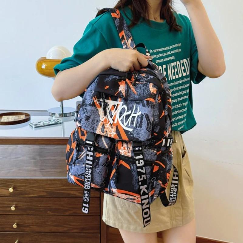 Přizpůsobený pánský nylonový graffiti batoh Velkokapacitní Všestranná verze Korejský cestovní batoh na krátké vzdálenosti pro počítač