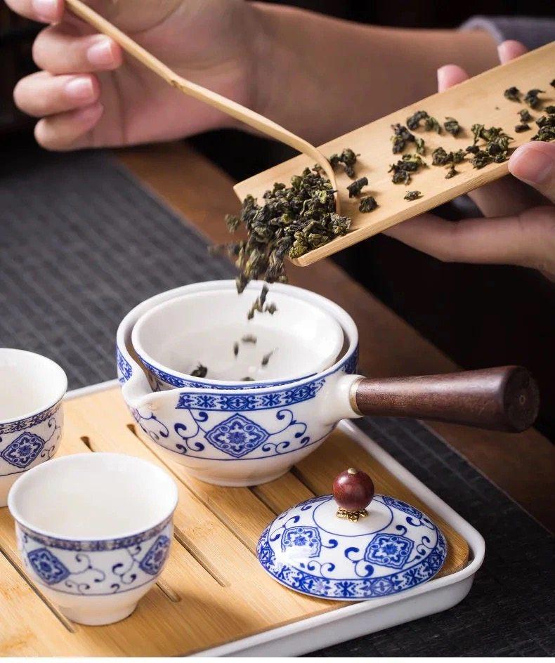 Compact Travel Tea Set with Automatic Rotating Teapot and Side Handle Kung Fu Cups