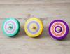 Traditional wooden colored throwing set of 3 toy, tops, (green, yellow, purple)