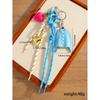 It is the same niche design PU blue shirt pendant keychain love braided rope versatile bag pendant accessories.