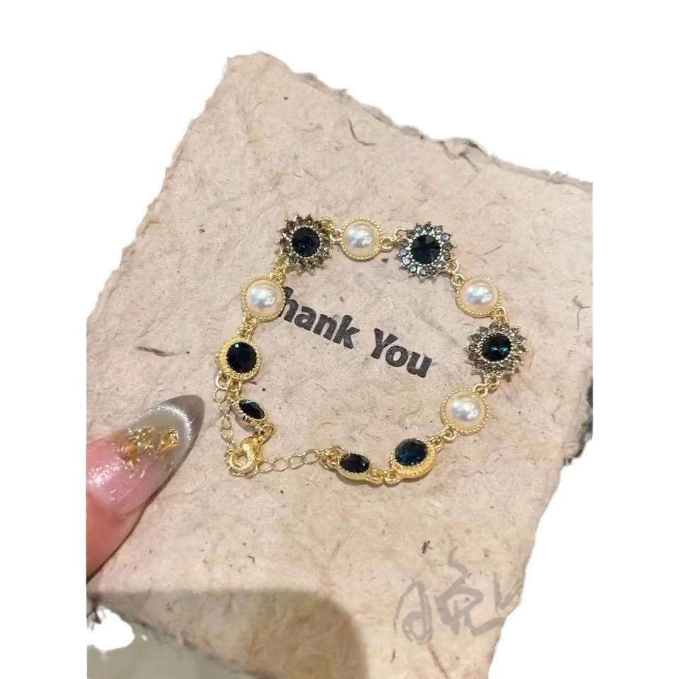 Sonnenthematischer Schmuck Handkette mit Imitationsperlen und funkelnden Strasssteinen für Damen