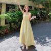 French Milk Yellow Pleated Suspender Summer Dress Female Sweet and Unique Beautiful Seaside Vacation Style A-shaped Long Dress