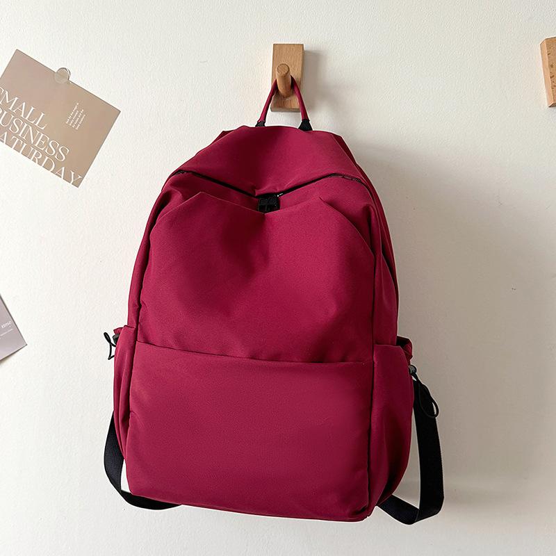 Schoolbag new versatile solid color large-capacity backpack women's schoolbag male college student junior high school student casual computer bag