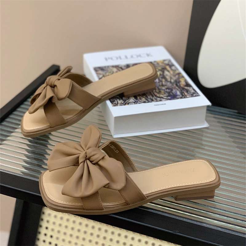 Low-heeled bow one-word drag women's summer wear flat-bottomed square-head slippers 2025 new seaside beach shoes