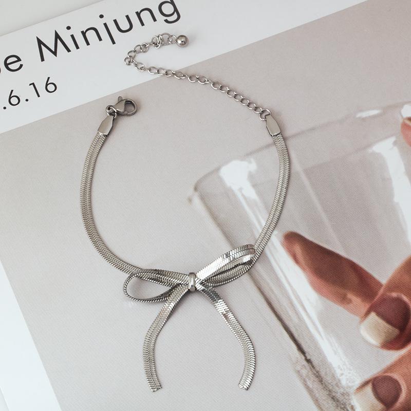 

Минималистичное геометрическое ожерелье-бант из нержавеющей стали высокого класса и женский титановый браслет