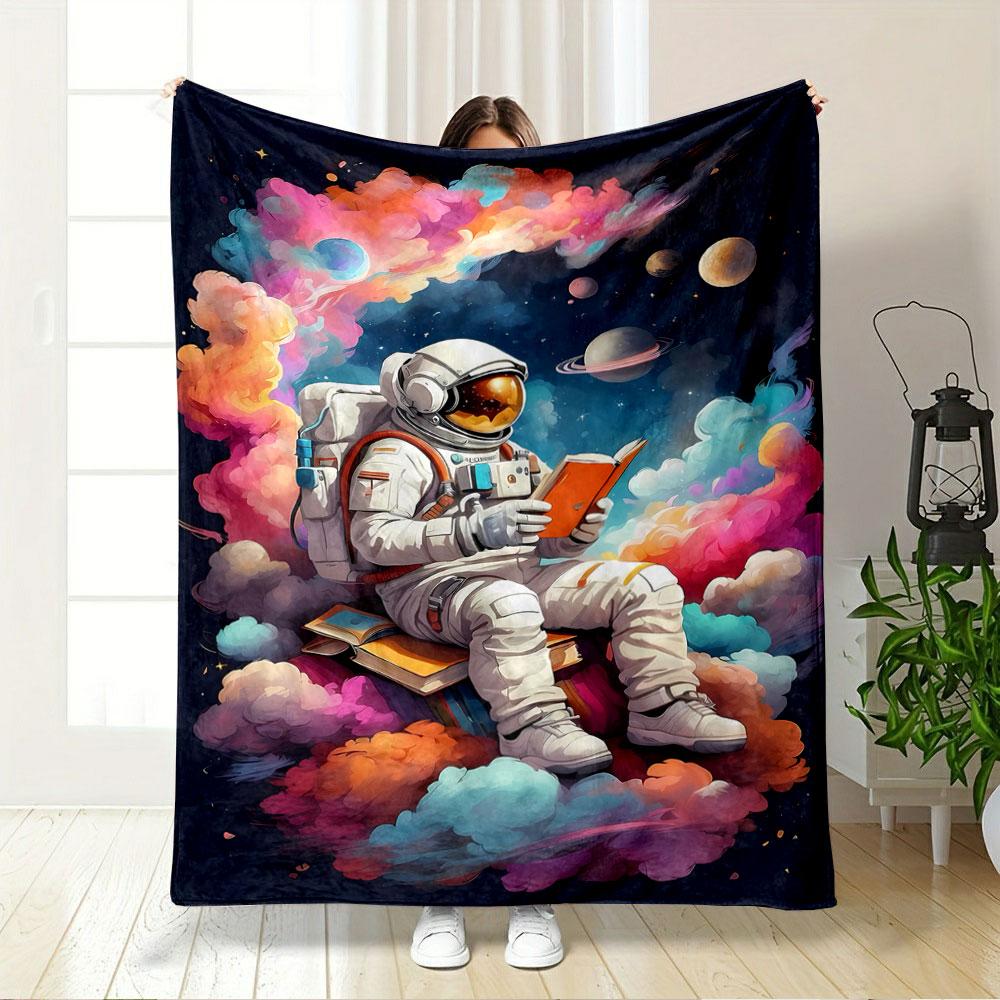 An Astronaut Reads a Book Amidst Colorful Clouds and a Space Backdrop. for All Seasons Blanket Lunch Break Throw Gift