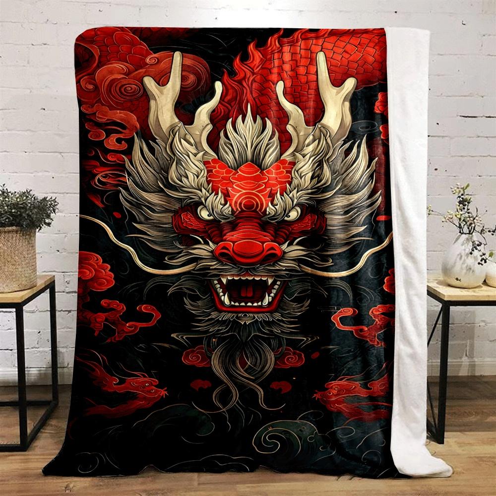 Fiery dragon head with horns, surrounded by red scales and swirling clouds. for all seasons blanket lunch break throw gift