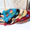 Handmade crocheted ear protection hat women's autumn and winter ethnic style colored flower knitted hat fringed strap ball bag head wool hat