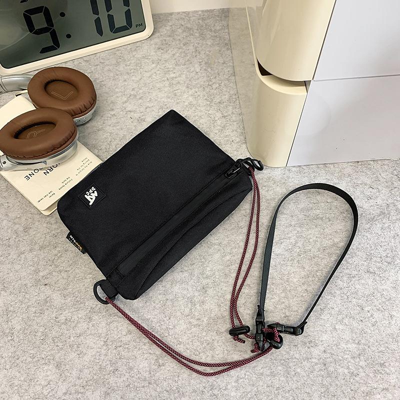 

Trendy brand small satchel female design sense male messenger bag niche commuter portable sports couple mobile phone bag красный
