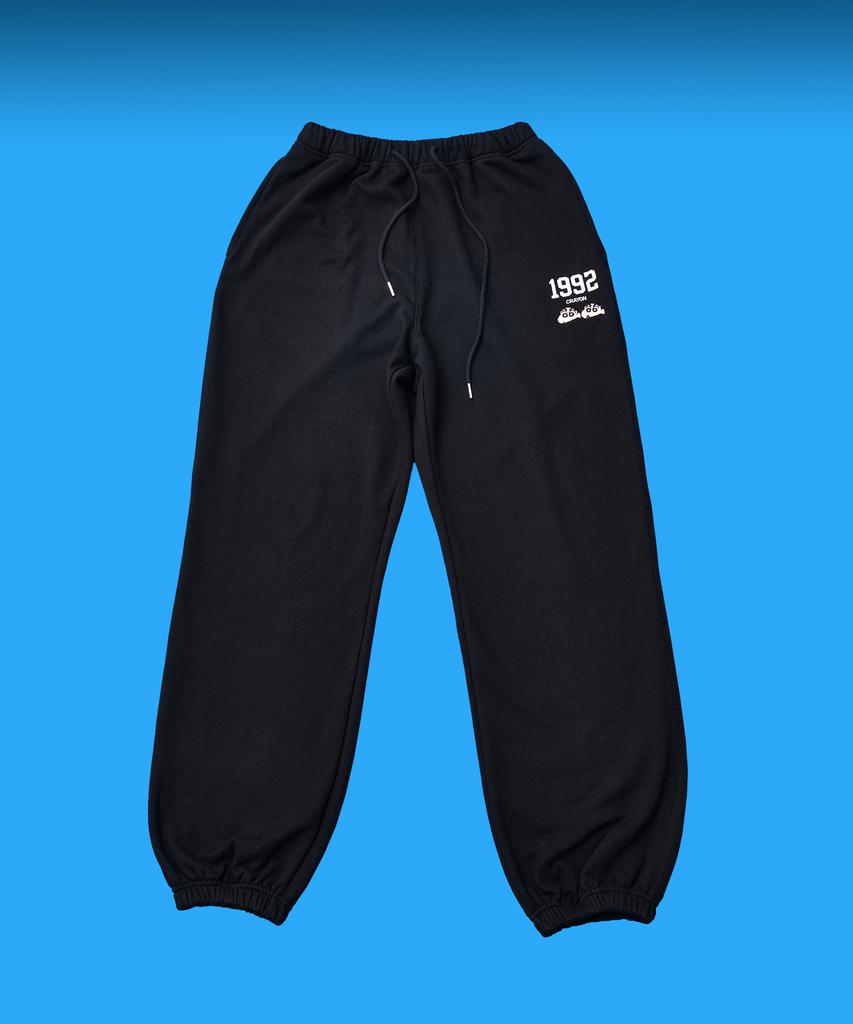 Daenkkomma Crayon Shin-Chan 1992 Face Embroidery Sweatpants (Black, Cream)