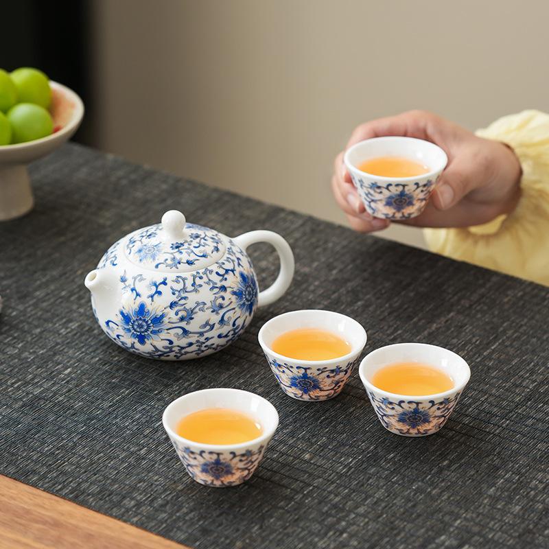 Guochao neuer chinesischer Talgjaspis verschlungene Lotosblüte Xishi-Kanne Kung-Fu-Teeservice Chinesische High-End-Ledertasche Geschenkdruck