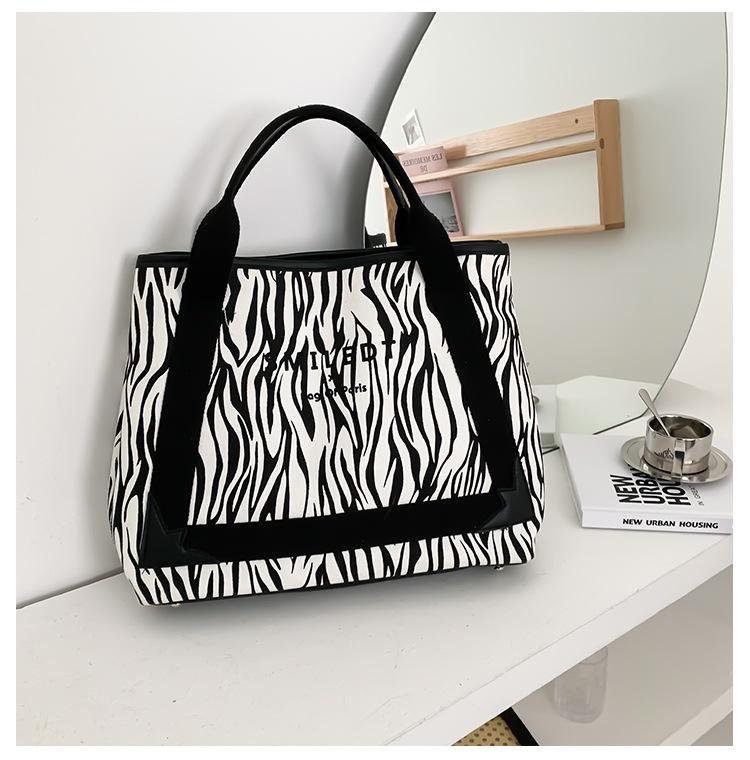 

2026 Spring Women s Canvas Tote Bag Spacious Minimalist Letter Print Crossbody Shoulder Purse Women s bag large capacity 42x33x11cm