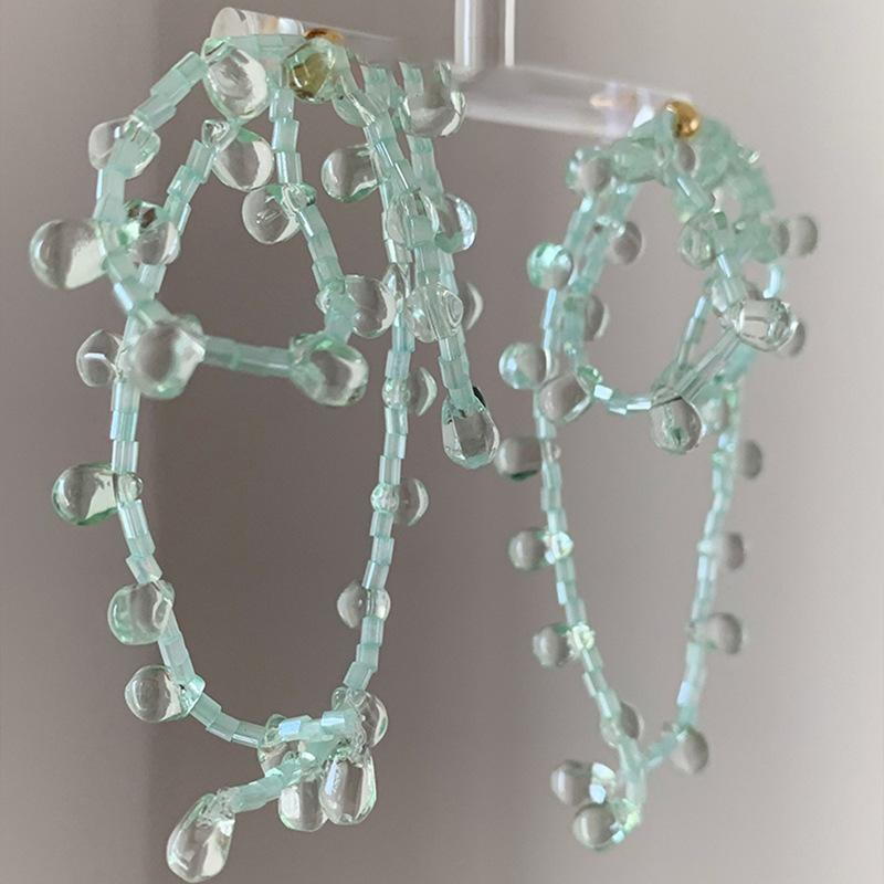 

Mint green glass bead bow fringed earrings fashionable and fresh earrings exaggerated earrings niche high sense