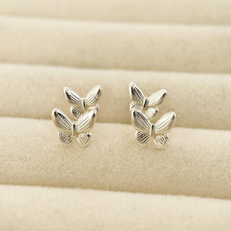Minimalistische Doppel-Schmetterling-Ohrringe: Elegante High-End Damen-Stecker mit modischem Design