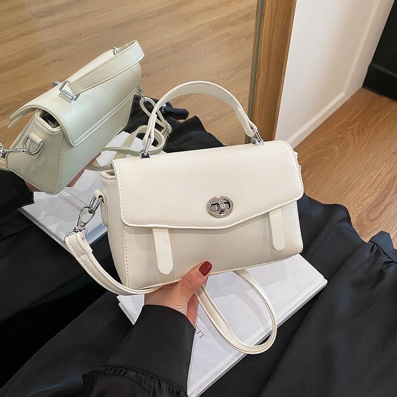 Summer new fashionable solid color lock flip bag versatile portable shoulder oblique span women's bag