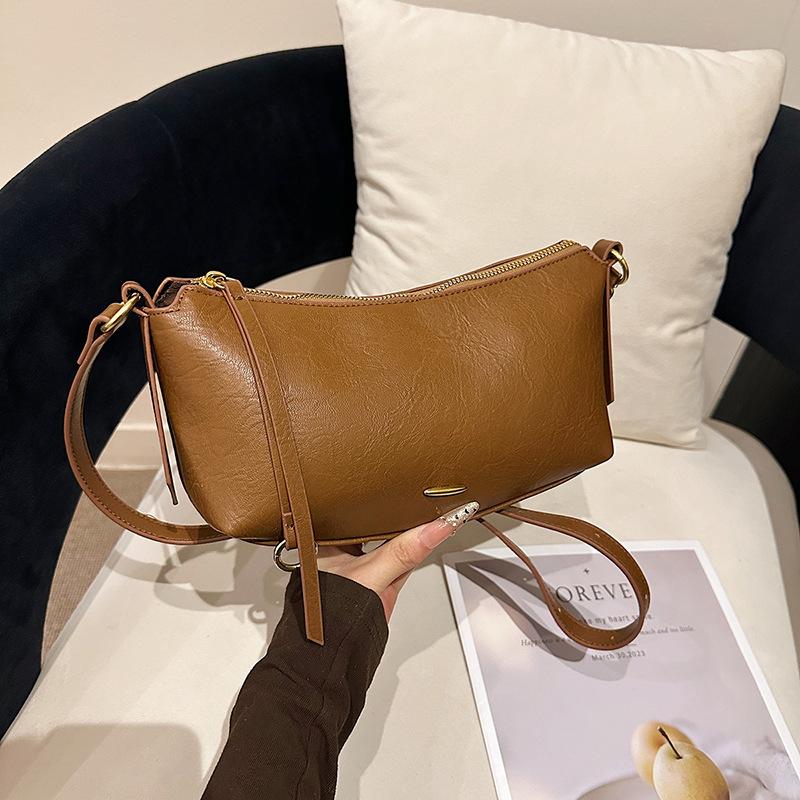 

Trendy Spring Minimalist Dumpling Shoulder Bag Casual and Simple Crossbody Bag Soft Leather Underarm for Women Commuting Bag