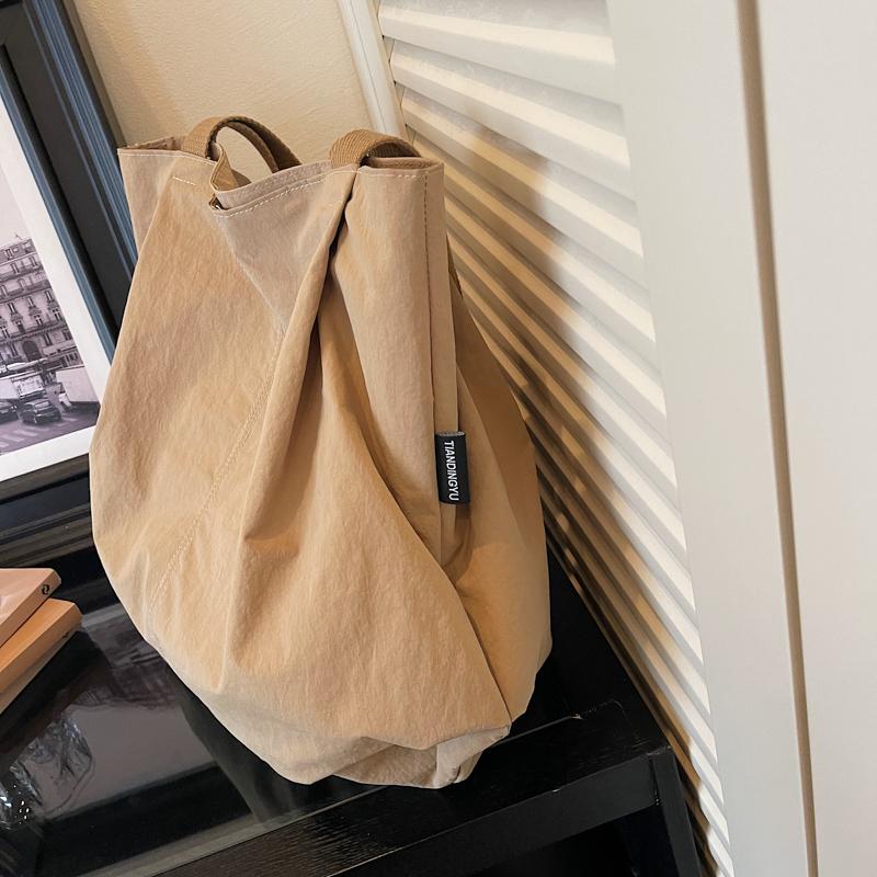 Minimalist Nylon Tote Bag with Spacious Design and Durable Handles Perfect for Everyday Use and Shopping