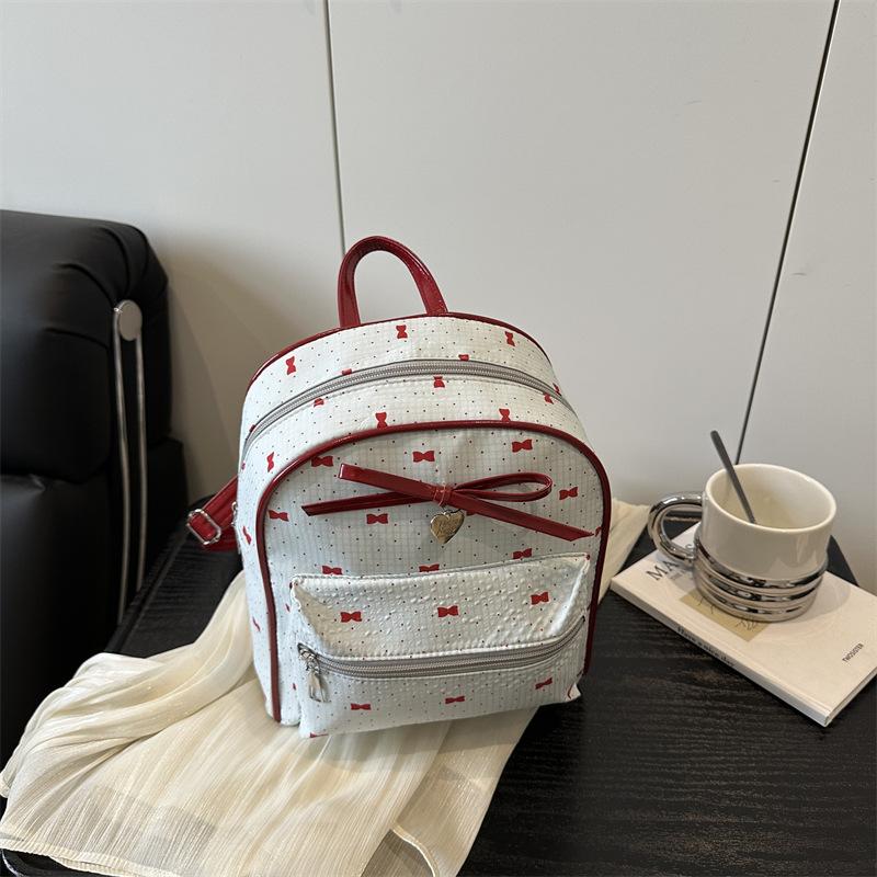 Schoolbag Korean version of college style women's shoulder bag 1011 new summer fashion bow small backpack shopping commuter bag