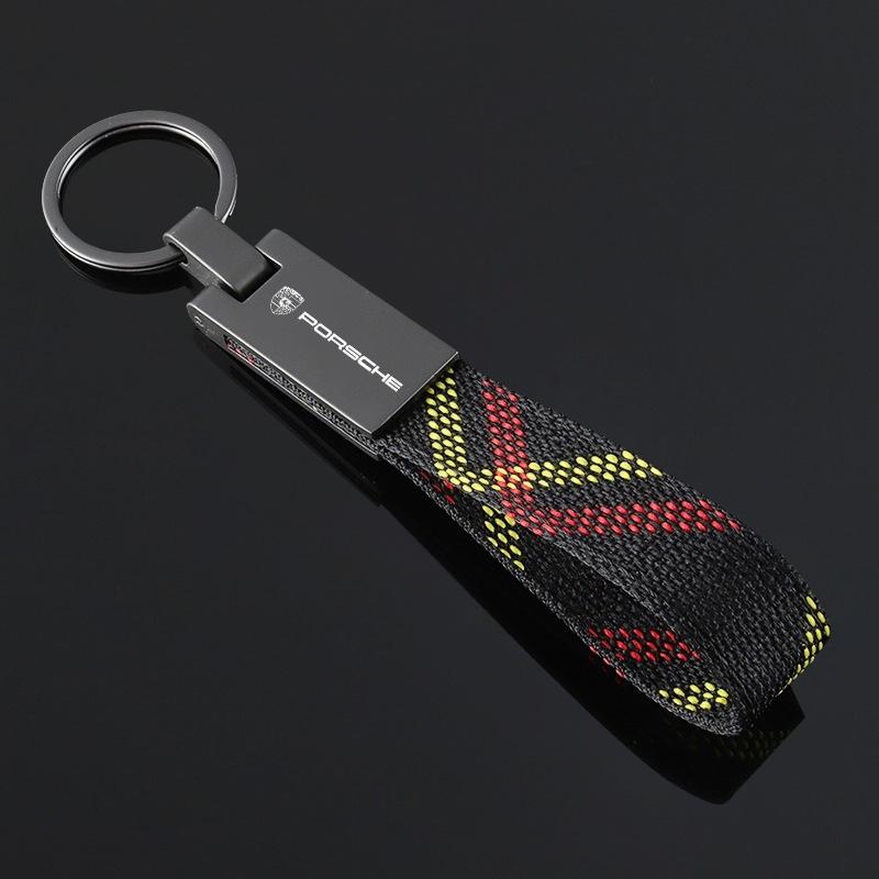 

Zinc Alloy Nylon Tricolor Woven Belt Car Keychain Pendant For Porsche 911 718 Taycan Panamera Cayenne Macan Boxster Cayman Pajun