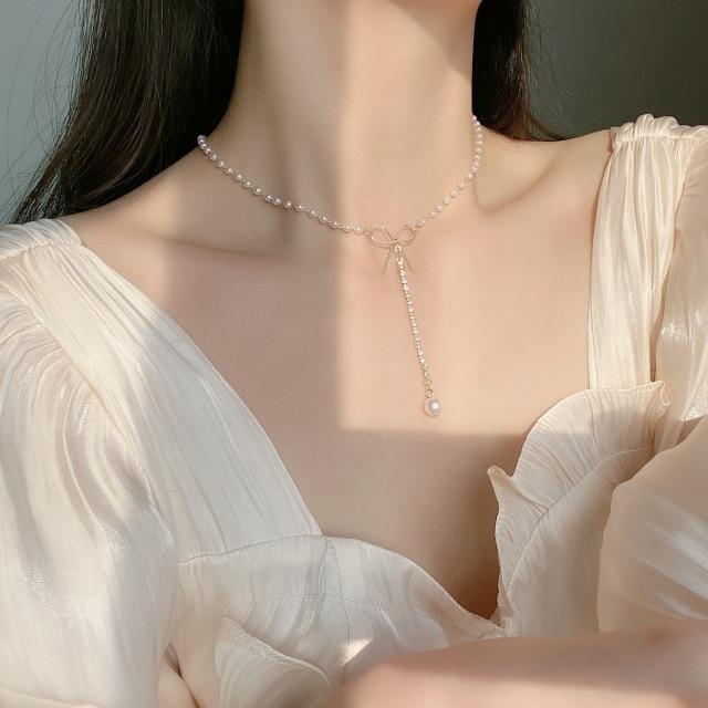 Jemné perlové květinové mašličkové choker náhrdelníky Dlouhý řetízek s přívěskem perlového srdce ve zlatém tónu Náhrdelníky s přívěskem mince Pro stylové šperky Ženy Elegantní Květinové náhrdelníky