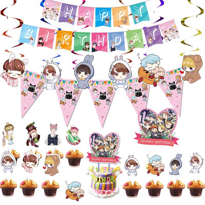 Fournitures de fête d'anniversaire festives sur le thème de BTS avec un cake topper coloré et des cupcake toppers joyeux