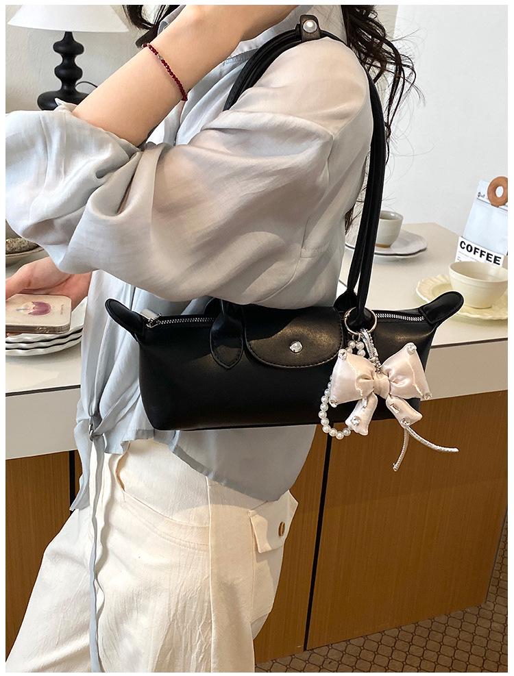 2026 French Light Luxury Cowhide Long Handle Dumpling Baguette Crossbody Bag
