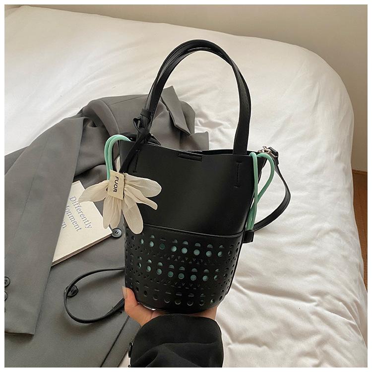 

2025 new summer hollow bucket bag women s simple niche fashion exquisite shoulder crossbody dual-purpose bag women