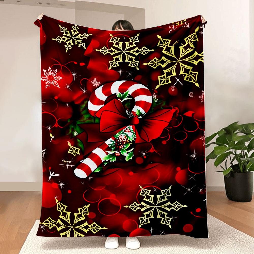 Christmas Blanket - A festive printed throw with red background, white-and-red striped candy cane, green holly, golden/snow whit 75X95CM