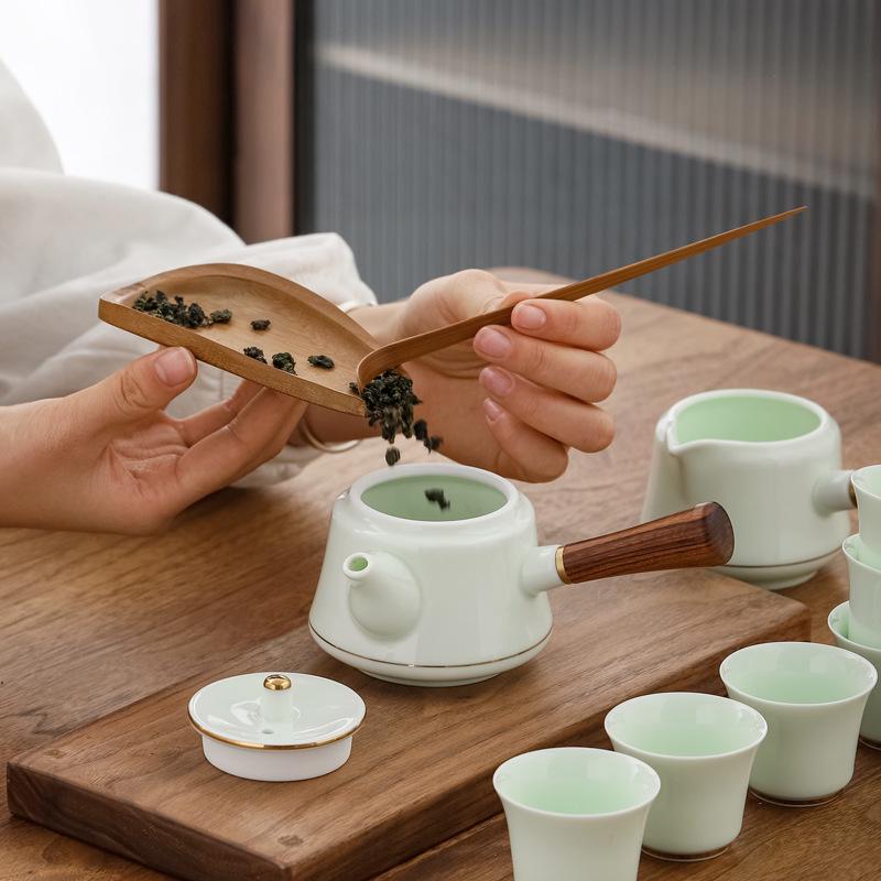 Jade Green Travel Tea Set: One Pot, Four Cups, with Wooden Side Handle and Tea Caddy.