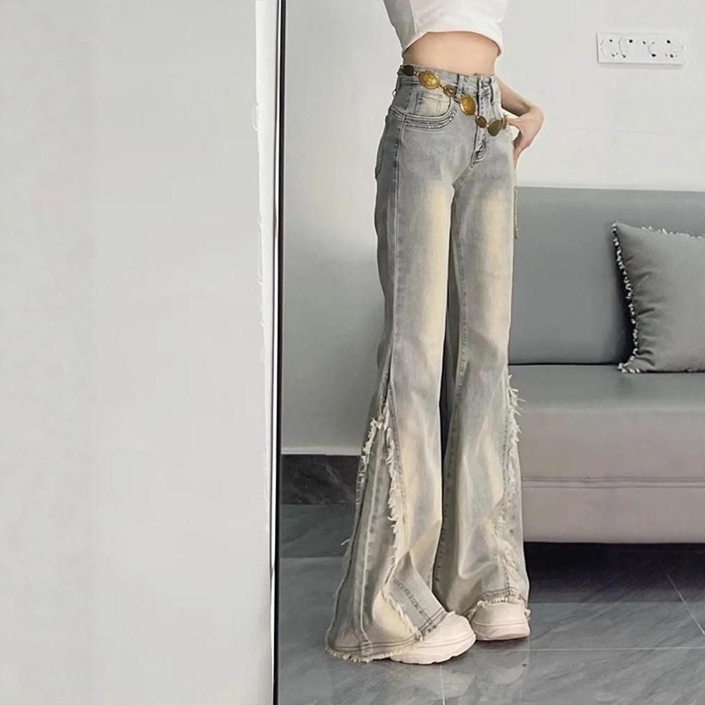 American retro micro-pull jeans women's 2026 spring and summer new rough edge splicing design sense slim and thin horseshoe pants