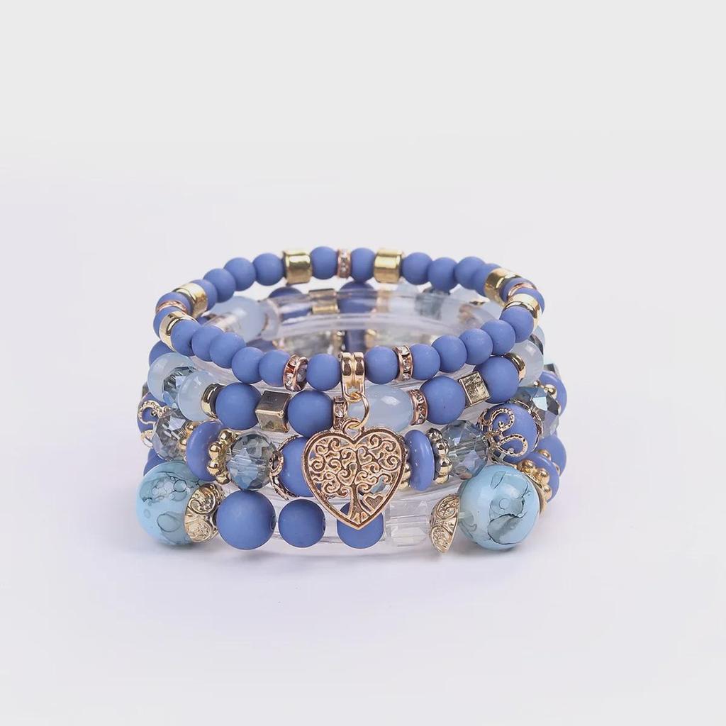 Bohemian Multi-Layer Tassel Bracelet Set with Hollow Heart Pendants and Glass Beads.