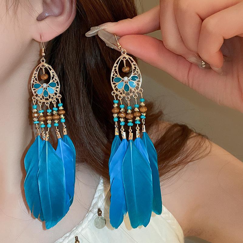 

Bohemian water drop feather rice bead fringed earrings ethnic wind ear hook temperament vacation wind earrings