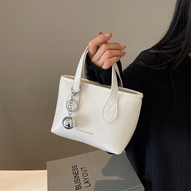 Handheld small bag women's new ins fashion minimalist style shoulder messenger bag oily leather bucket bag