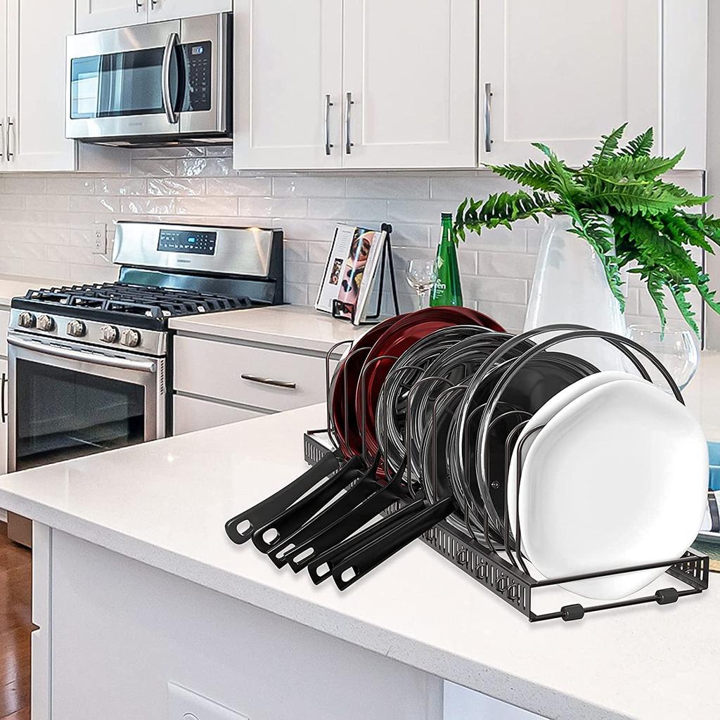 Extendable frying pan rack with 7 compartments, perfect for storing pans, pots, lids, and cutting boards.