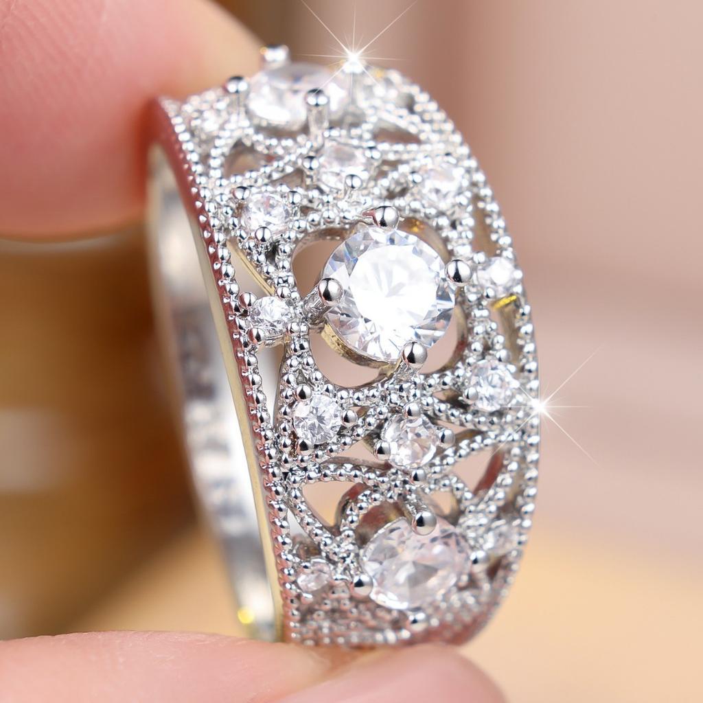 Heavy-duty, intricately carved, vine-patterned, wide ring with full diamond embellishments Light luxury, versatile, multi-layered ring with a central