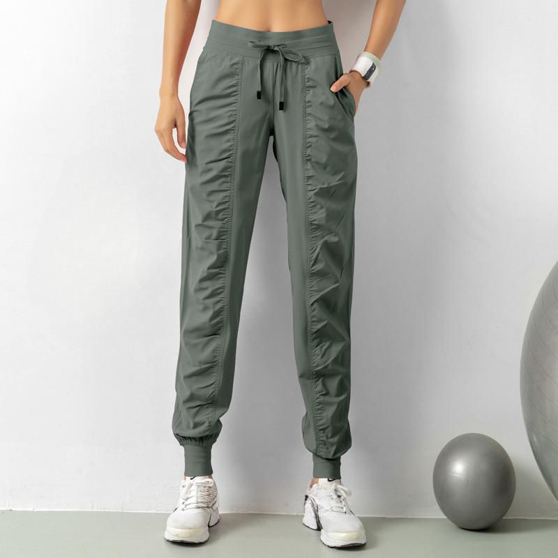 Bağcıklı Bel ve Yan Cepli Kadınlar İçin Hızlı Kuruyan Atletik Jogger Pantolon - Koşu ve Antrenman İçin Slim Fit, Nefes Alabilen Polyester Karışımı