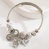 Panjia Dora Stainless Steel Bracelet: Women's Adjustable Bracelet with Diamond Beads & Love Pendant.