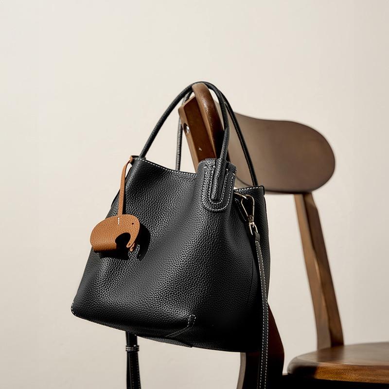 Summer new fashion leather bucket bag niche first layer cowhide retro single shoulder diagonal span portable vegetable basket bag