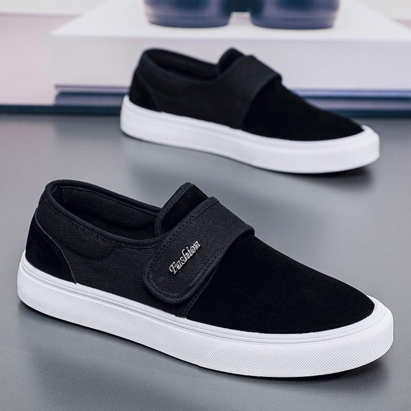 Fashion breathable versatile black and white color matching one-pedal Velcro low-top men's shoes student canvas board shoes