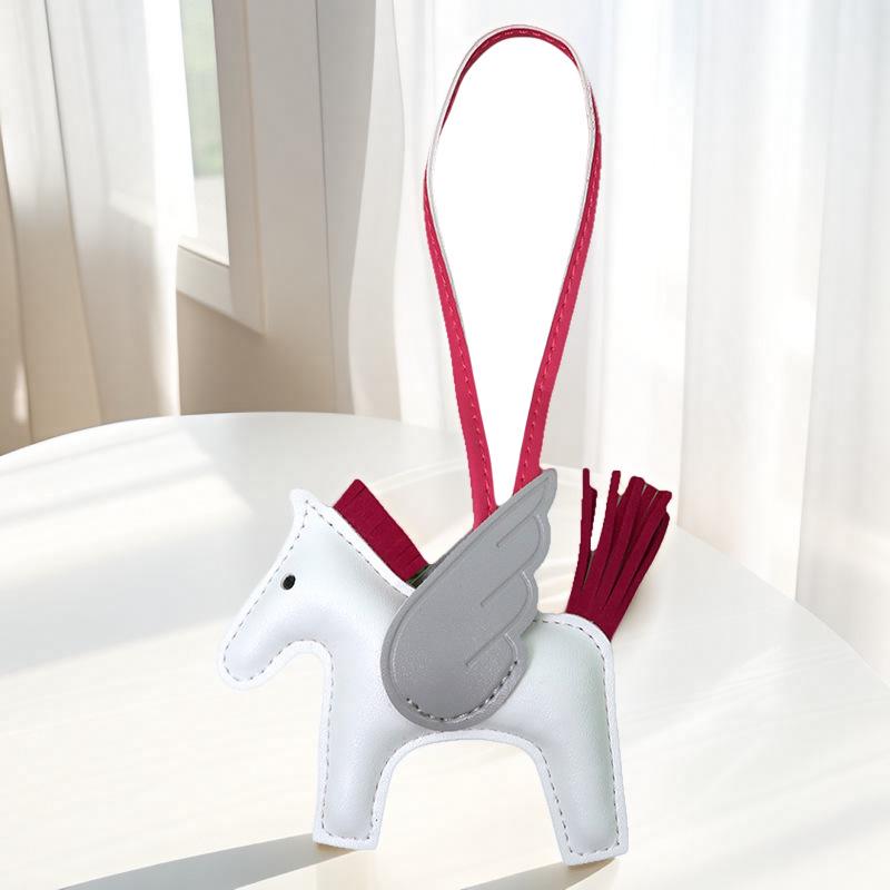 Portachiavi con ciondolo Pegasus a contrasto con motivo a cartone animato, con nappa e pony in pelle