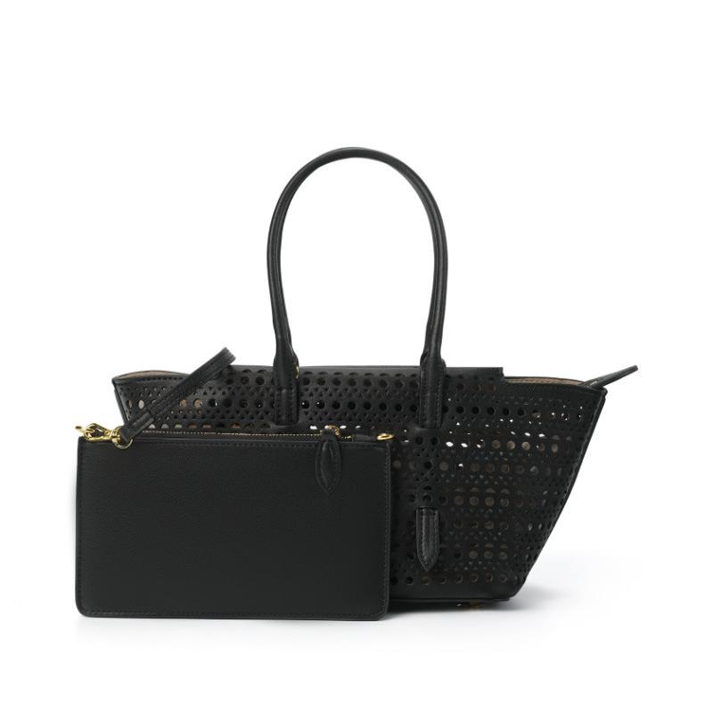 

Полая черная новая женская ручная сумка через плечо большой вместимости женская сумка-тоут из коровьей кожи для通勤, премиальное ощущение, сумка-тоут под мышкой