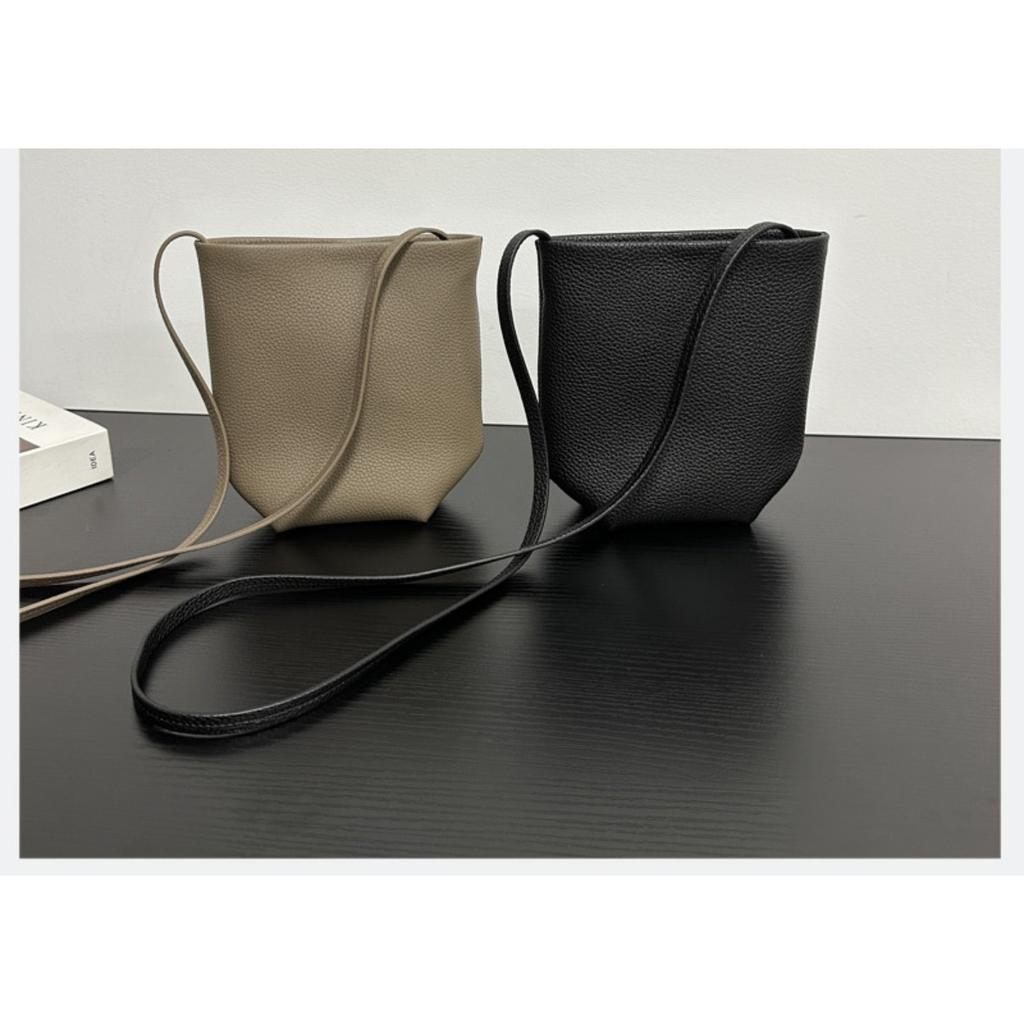 Row wind niche imported first-layer cowhide commuter mini bucket bag minimalist wind shoulder portable oblique span mobile phone bag