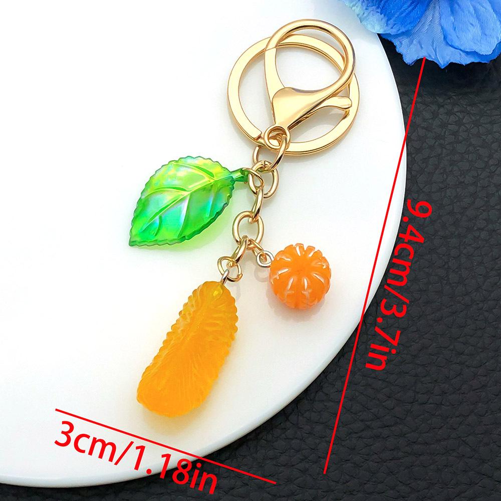 Cross-border Creative Cute Resin Leaf & Orange Keychain: Car, Bag, & Fruit Charm.